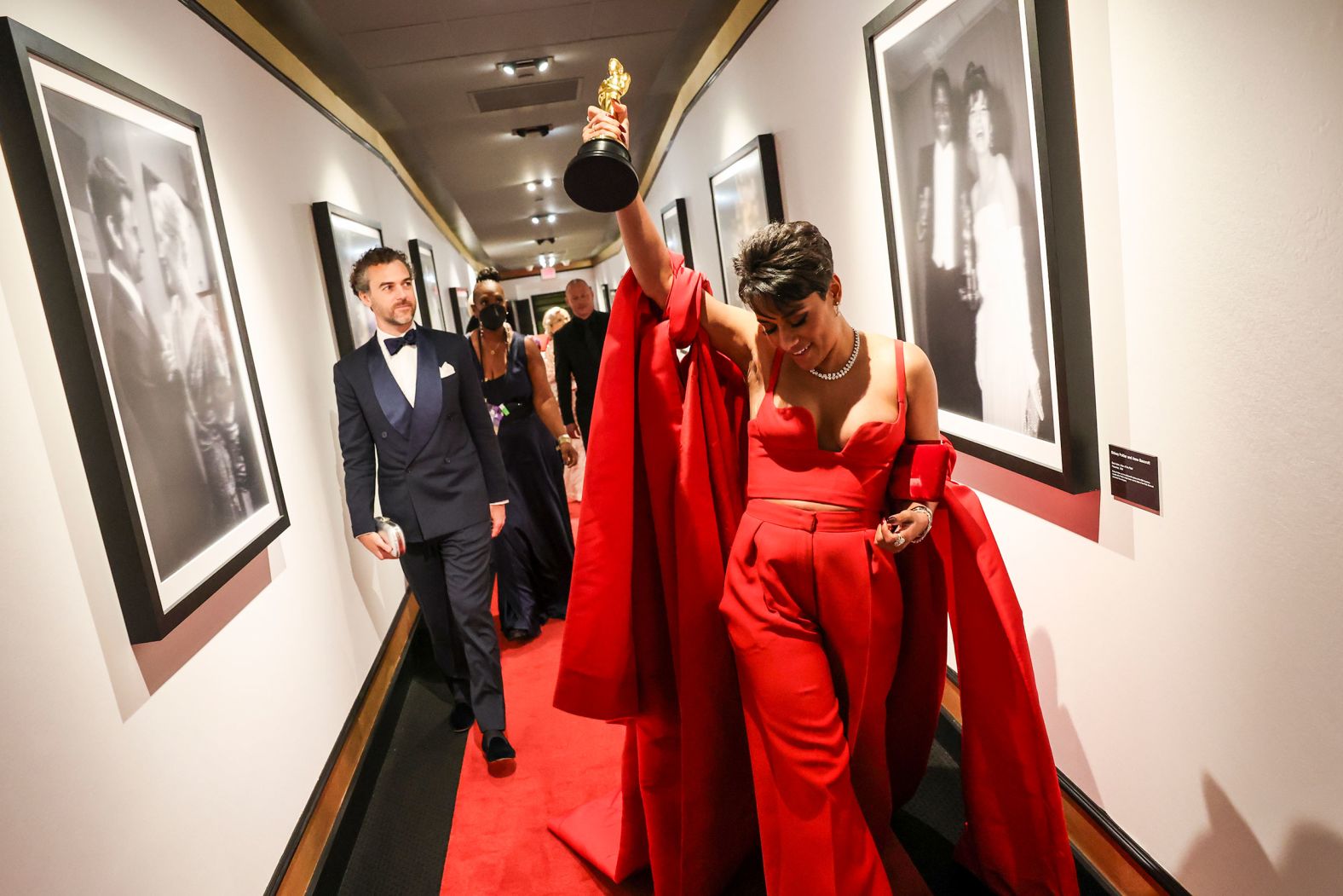 Best supporting actress Ariana DeBose holds her Oscar backstage.