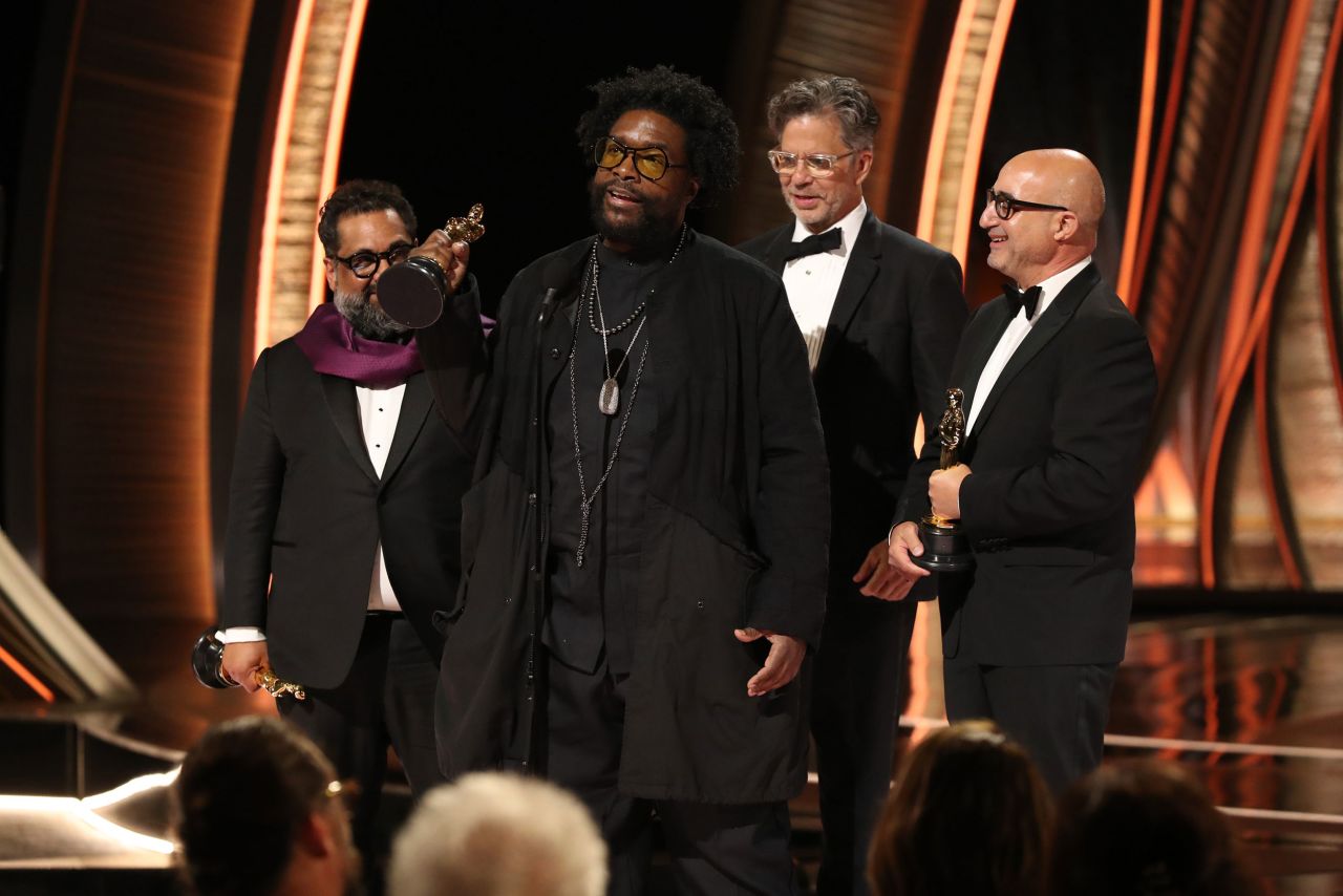 Ahmir "Questlove" Thompson accepts the Oscar for best documentary feature. The Roots drummer directed "Summer of Soul (...Or, When the Revolution Could Not Be Televised)."