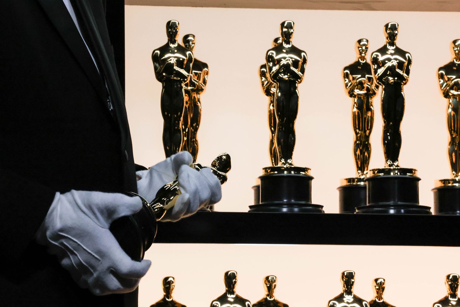 Oscar statuettes sit on display behind the scenes.