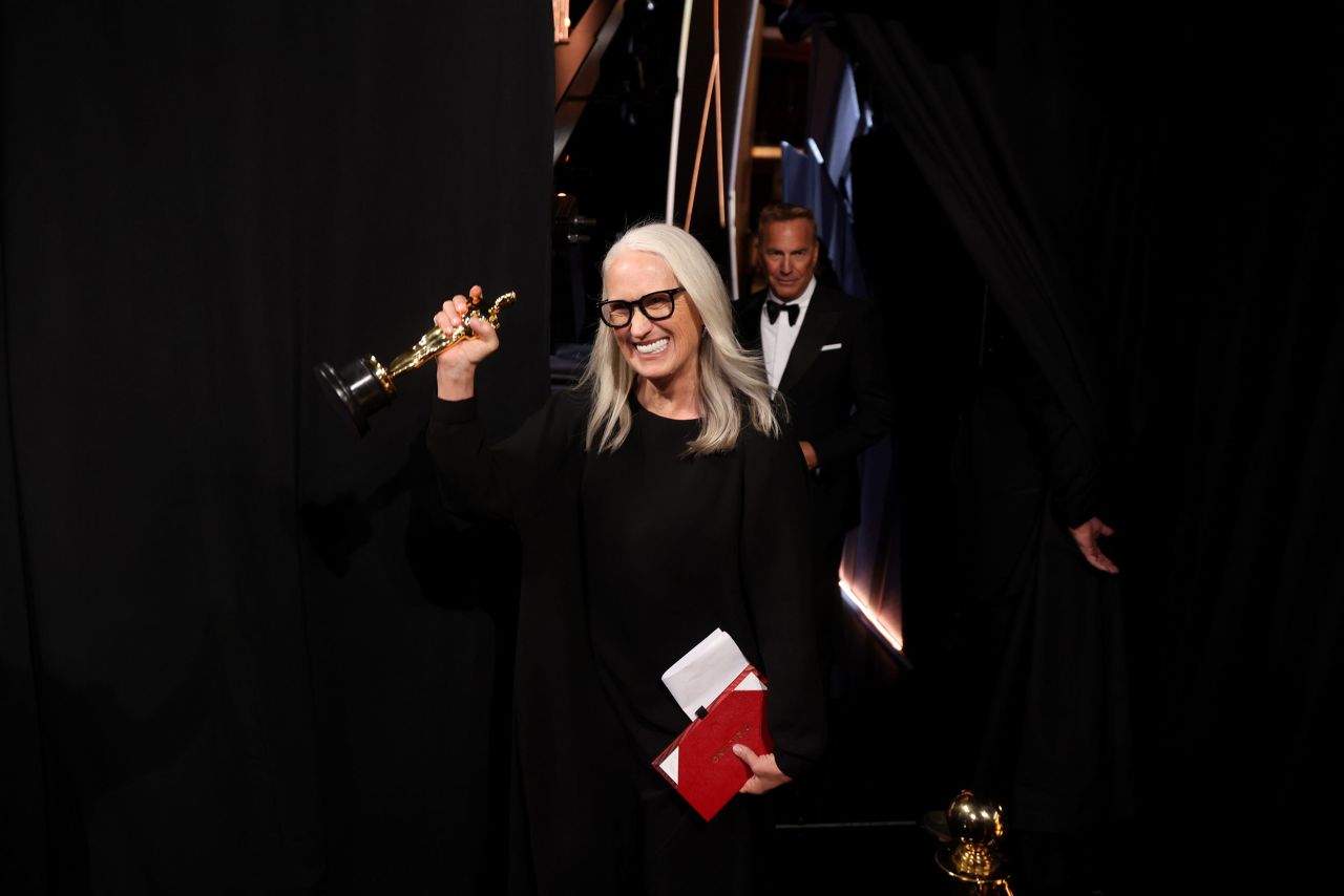 "Power of the Dog" director Jane Campion walks backstage after winning the Oscar for best director.
