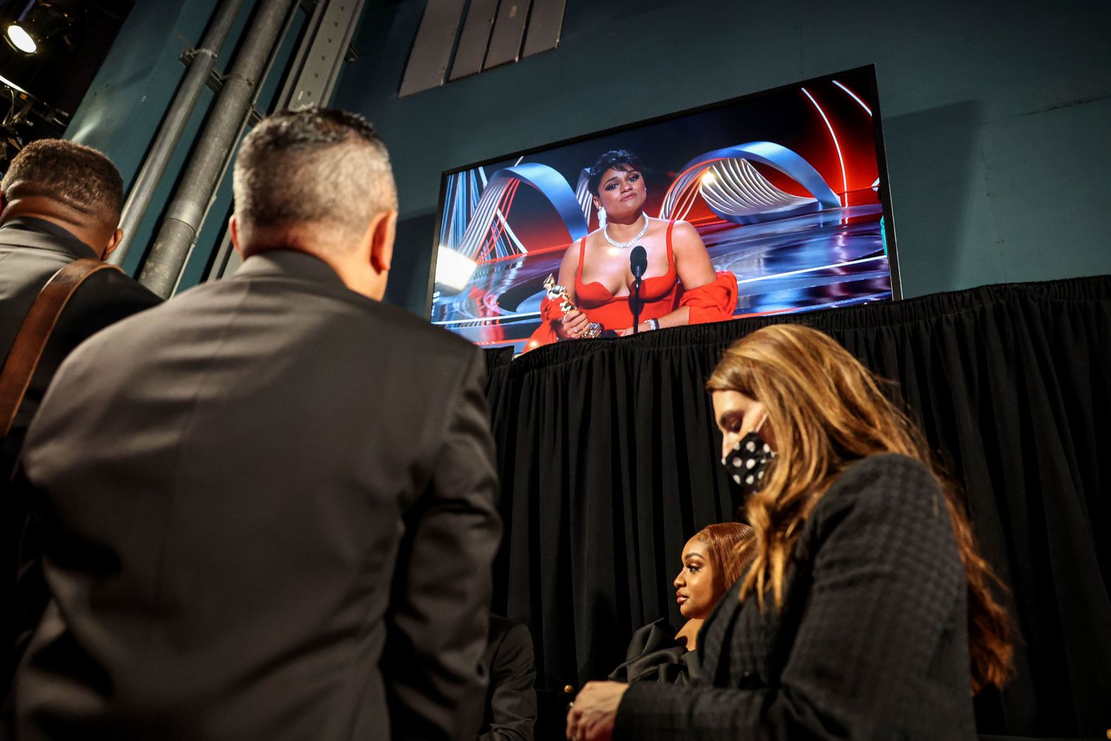 DeBose's acceptance speech is shown backstage during the show.