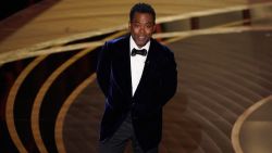 Chris Rock presents the award for best documentary feature at the Oscars on Sunday, March 27, 2022, at the Dolby Theatre in Los Angeles. (AP Photo/Chris Pizzello)