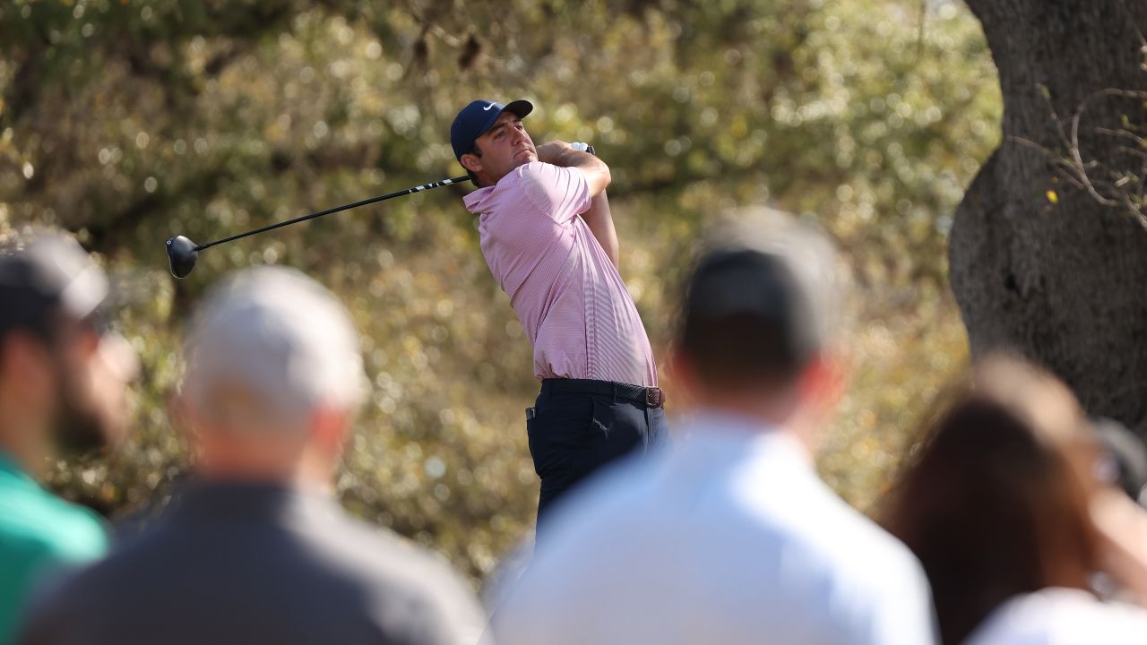 Scheffler plays his shot from the eighth tee in his semifinal match against Dustin Johnson.