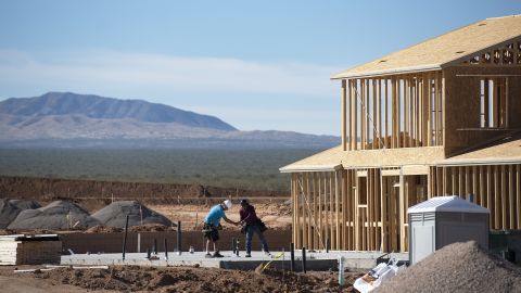 Contractors work on a new home in Tucson, Arizona, where housing prices have increased by double-digit percentages over the past year. 