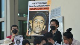 Activists hold posters against the execution of Nagaenthran K. Dharmalingam, sentenced to death for trafficking heroin into Singapore, outside the Singapore High Commision in Kuala Lumpur on March 9, 2022. (Photo by Arif Kartono / AFP) (Photo by ARIF KARTONO/AFP via Getty Images)