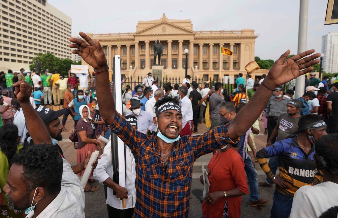 Opposition party supporters shout slogans during a protest outside the President's office in Colombo, Tuesday, March 15, 2022.