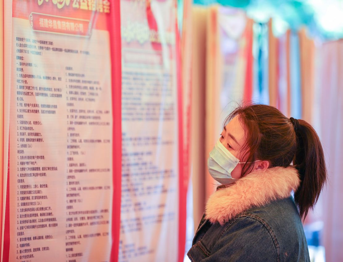 A job seeker looks for opportunities at a job fair in Jinjiang city, Fujian province, China, in February.