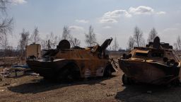 Two destroyed Russian APC (armoured personnel carriers) are seen on March 25 in Kyiv.