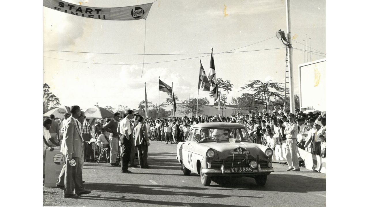 The race was first established as the Coronation Rally in 1953, to honor the soon-to-be crowned Queen Elizabeth II, when Kenya was still part of the British Empire. The rally took place between Kenya, Uganda and part of present-day Tanzania, and was timed to finish during her coronation ceremony. Pictured: W.F.C. Young and L. Baillon in their Ford in the 1959 Coronation Rally.