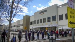 In this photo taken from video, Amazon workers line up outside the company's Staten Island warehouse to vote on unionization, Friday, March 25, 2022, in New York. Amazon is gearing up for its toughest labor fight yet, with two separate union elections coming to a head as soon as next week that could provide further momentum to the recent wave of organizing efforts across the country. Warehouse workers in Staten Island, New York and Bessemer, Ala., will determine whether or not they want to form a union.