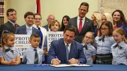 Florida Gov. Ron DeSantis signs the Parental Rights in Education bill at Classical Preparatory school Monday, March 28, 2022 in Shady Hills, Florida.