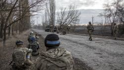 LUKâYANIVKA, KYIV PROVINCE, UKRAINE, MARCH 28: Ukrainian army servicemen and Territorial Defense Force units take cover behind military armored vehicles as they advance to the battlefield to fight against Russian army in Lukâyanivka frontline, eastern of Kyiv, Ukraine, March 28th, 2022. (Photo by Narciso Contreras/Anadolu Agency via Getty Images)