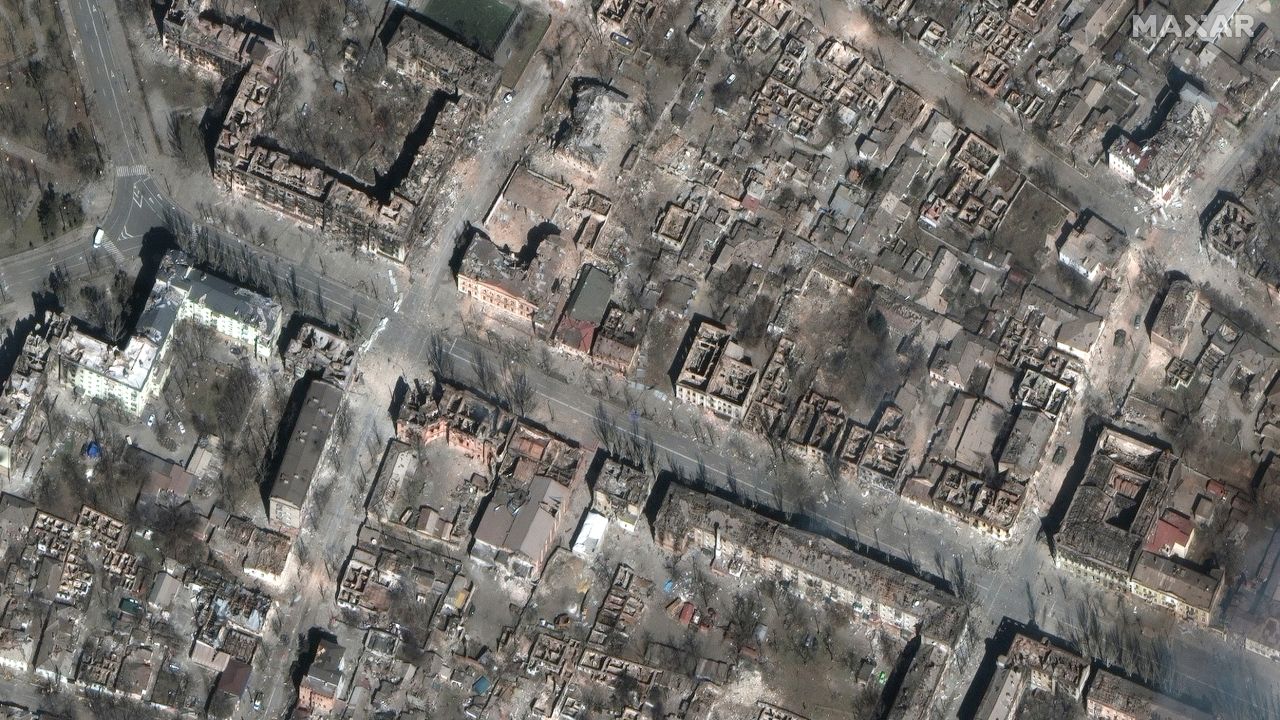 A satellite photo shows entire city blocks destroyed in central Mariupol.