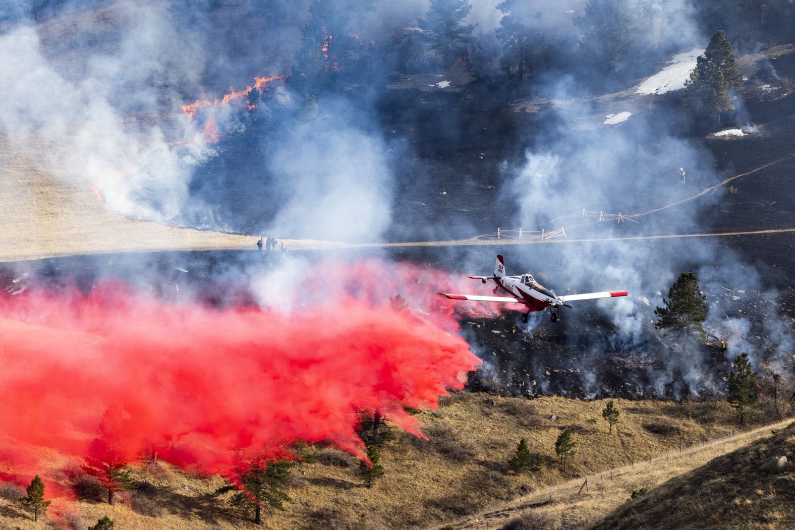 An air tanker works in Boulder on March 26.