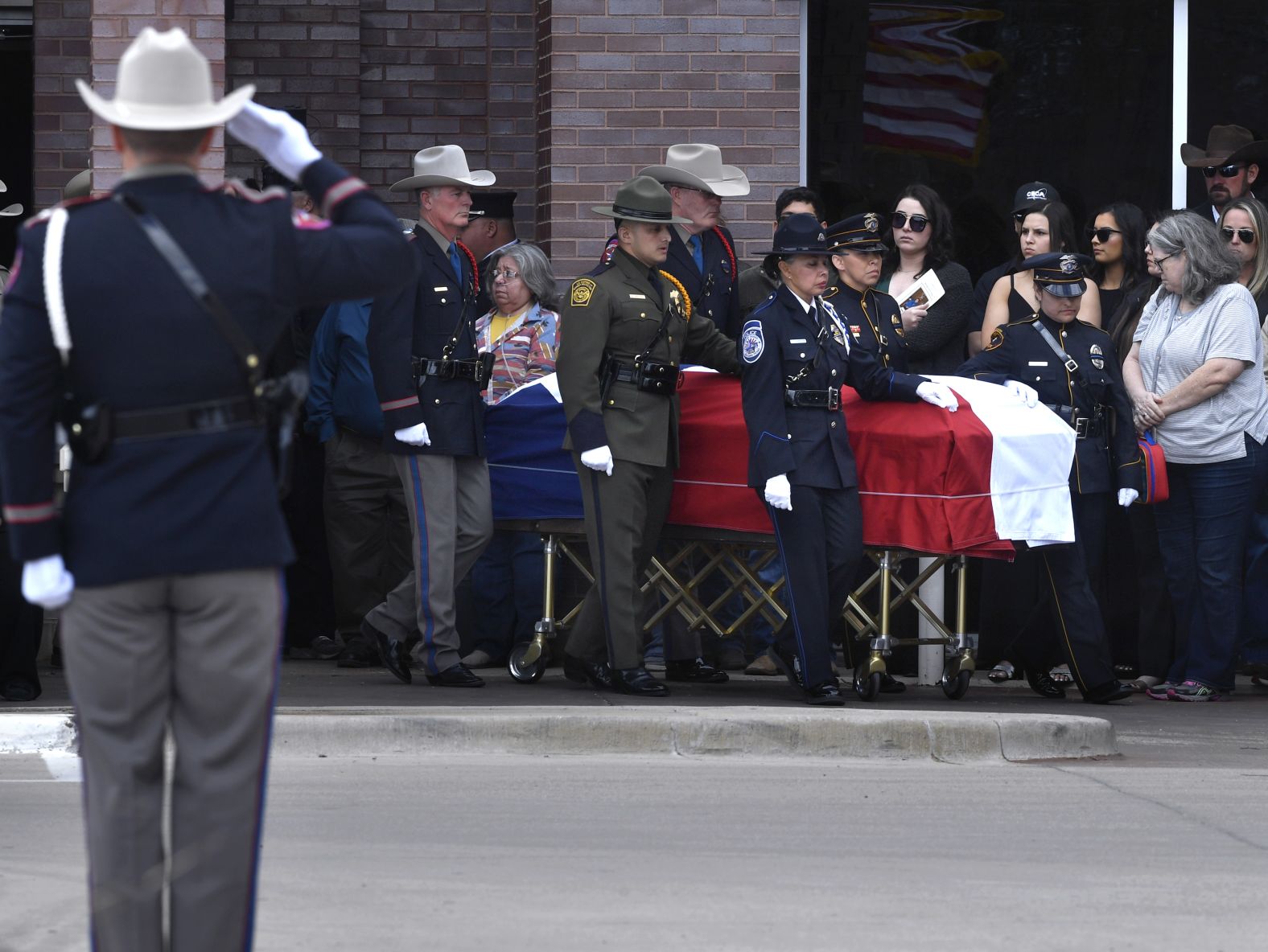 An honor guard carries Fenley's casket in Cisco, Texas, on March 23.
