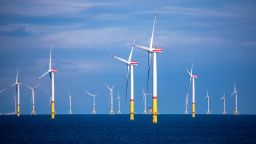 29 August 2020, Mecklenburg-Western Pomerania, Mukran: Wind turbines rotate in the Baltic Sea between the islands of Rügen and Bornholm (Denmark). The wind farm, about 35 kilometers northeast of Rügen, has a capacity of 385 megawatts, which is mathematically sufficient to supply 400,000 households. According to the client E.ON, the wind farm with 60 turbines was built in the record time of 14 months. Photo: Jens Büttner/dpa-Zentralbild/ZB (Photo by Jens Büttner/picture alliance via Getty Images)