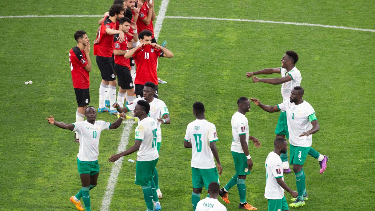 Senegal's players celebrate during a penalty shootout against Egypt. 