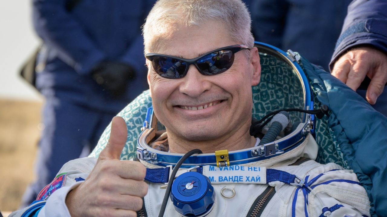 Mark Vande Hei sits outside of the Soyuz spacecraft after landing.