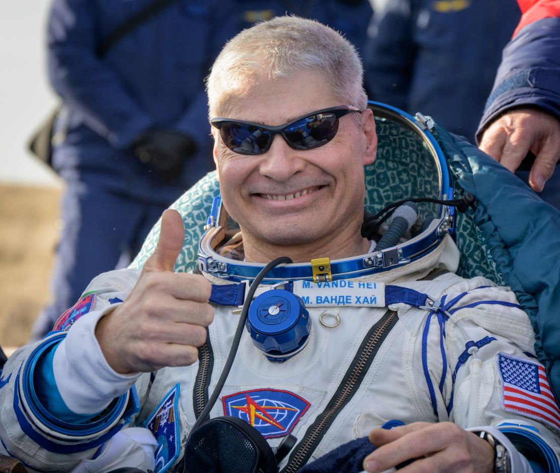 Mark Vande Hei sits outside of the Soyuz spacecraft after landing.