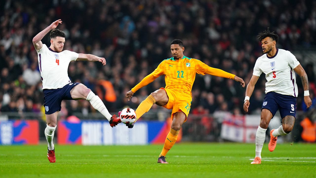 England's Declan Rice (left) and Ivory Coast's Sebastien Haller battle for the ball during a friendly match at Wembley Stadium.