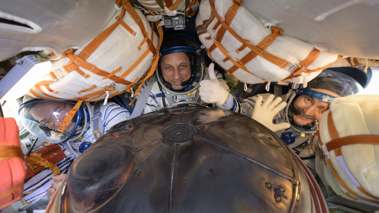 NASA astronaut Mark Vande Hei (left) and Russian cosmonauts Anton Shkaplerov, (center) and Pyotr Dubrov are seen inside their Soyuz MS-19 spacecraft after landing.
