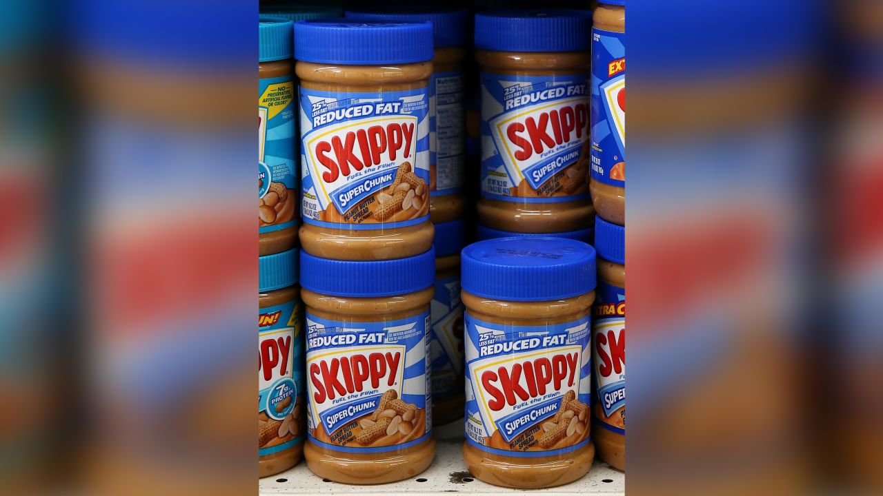 Jars of Skippy peanut butter are displayed on a shelf at a store on November 2, 2015 in San Rafael, California. Hormel Foods, maker of Skippy peanut butter, is recalling 153 cases of Skippy reduced fat creamy peanut butter that could contain metal shavings. The peanut butter was produced at the company's Little Rock, Arkansas, factory.