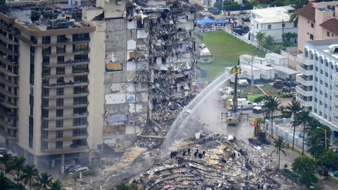 Rescue personnel work at the remains of the Champlain Towers South condo building in Surfside, Florida, on June 25, 2021.
