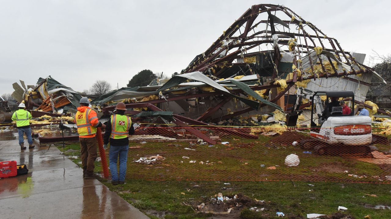 Workers begin cleanup at the George Elementary School gym Wednesday in Springdale, Arkansas, after a possible tornado swept through the city.