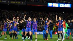 Barcelona's players celebrate at the end of the women's UEFA Champions League quarter final second leg football match between FC Barcelona and Real Madrid CF at the Camp Nou stadium in Barcelona on March 30, 2022. - A world record crowd for a women's football match of 91,553 saw Barcelona cruise into the Champions League semi-finals by thrashing Real Madrid 5-2 at Camp Nou to seal an 8-3 win on aggregate. (Photo by Josep LAGO / AFP) (Photo by JOSEP LAGO/AFP via Getty Images)