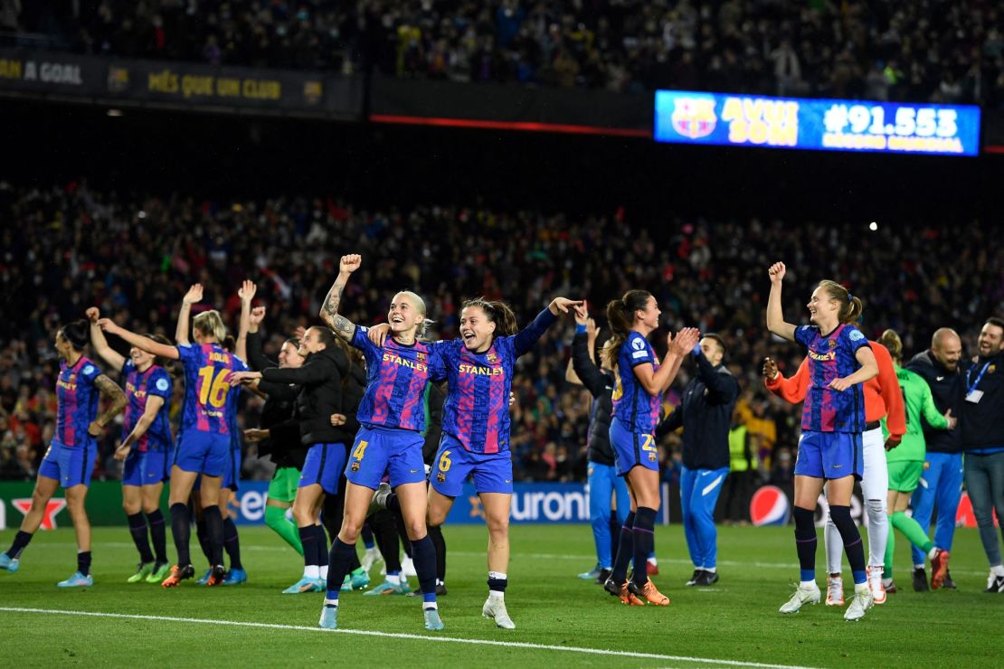 Barcelona's players celebrate at the end of the women's UEFA Champions League quarterfinal.