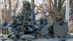 VOLNOVAKHA, UKRAINE - MARCH 26: Russian soldiers are seen on a tank in Volnovakha district in the pro-Russian separatists-controlled Donetsk, in Ukraine on March 26, 2022. Volnovaha, one of the 18 regions of Donetsk in eastern Ukraine, has been under the control of the Russian Armed Forces and the pro-Russian separatist in Donetsk since March 11. (Photo by Sefa Karacan/Anadolu Agency via Getty Images)