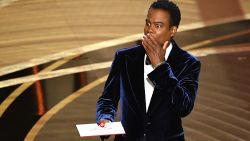 TOPSHOT - US actor Chris Rock speaks onstage during the 94th Oscars at the Dolby Theatre in Hollywood, California on March 27, 2022. (Photo by Robyn Beck / AFP) (Photo by ROBYN BECK/AFP via Getty Images)