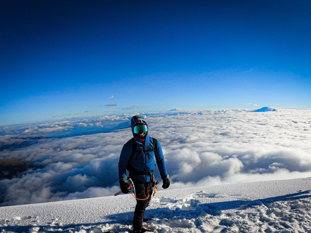 King says when he first picked up the sport in his 20s, he climbed in Walmart boots and a hoodie. He says that gear and expeditions are expensive and can be a barrier for entry into mountaineering. King relies on sponsorships to help outfit him. Here, he's pictured at the summit of Cotopaxi Volcano in Ecuador on November 7, 2021.