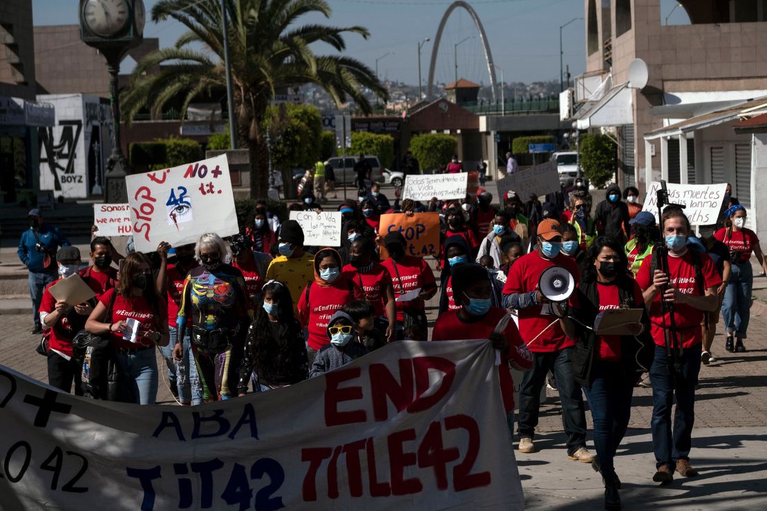 Migrants and asylum seekers march in Tijuana to protest the Title 42 policy on March 21.