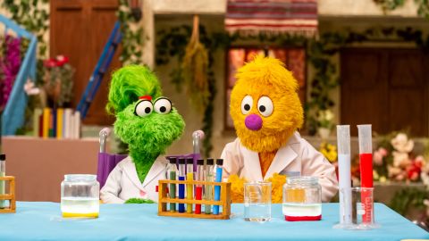 Ameera, left, the latest Muppet character from Sesame Workshop, loves to test out her ideas through science experiments.
