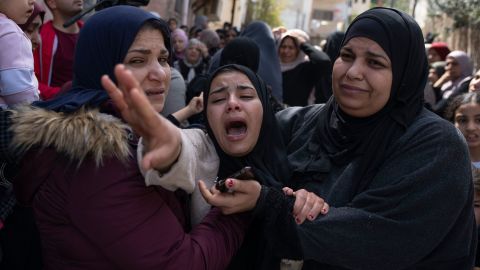 Palestinian Hadeel Abu Atiyeh cries during the funeral of her brother Sanad Abu Atiyeh in the West Bank on March 31.
