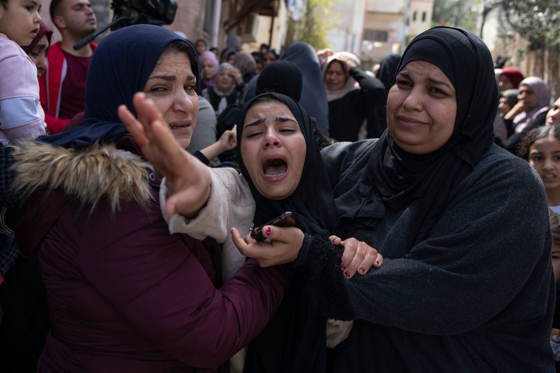 Palestinian Hadeel Abu Atiyeh cries at the funeral of her brother Sanad Abu Atiyeh in the West Bank on March 31.