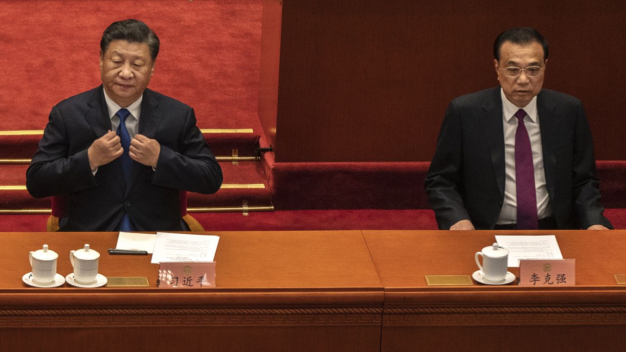 Chinese President Xi Jinping, left, sits beside Premier Li Keqiang at the Chinese People's Political Consultative Conference on March 10 in Beijing.