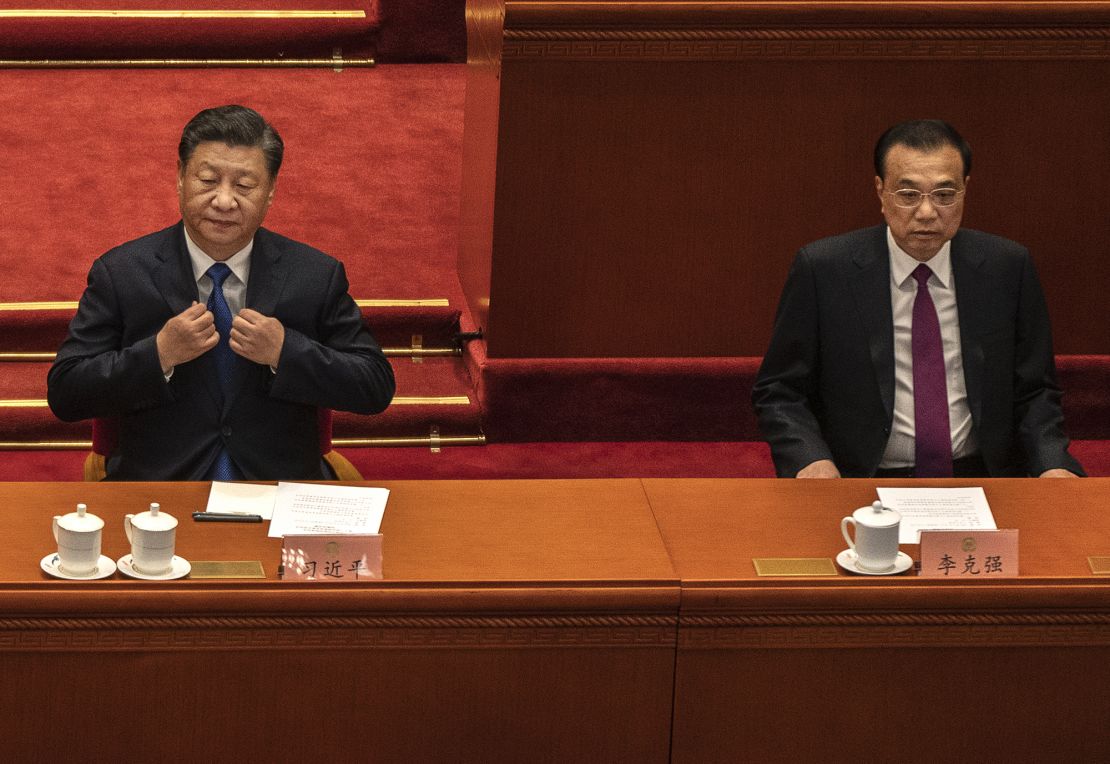 Chinese President Xi Jinping, left, sits beside Premier Li Keqiang at the  Chinese People's Political Consultative Conference on March 10 in Beijing.