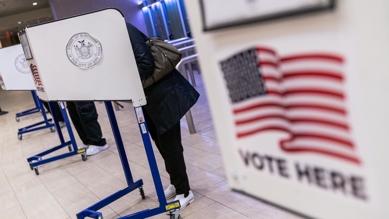 Voters cast ballots at an early voting polling location for the 2020 Presidential election at Madison Square Garden in New York, U.S., on Monday, Oct. 26, 2020. 
