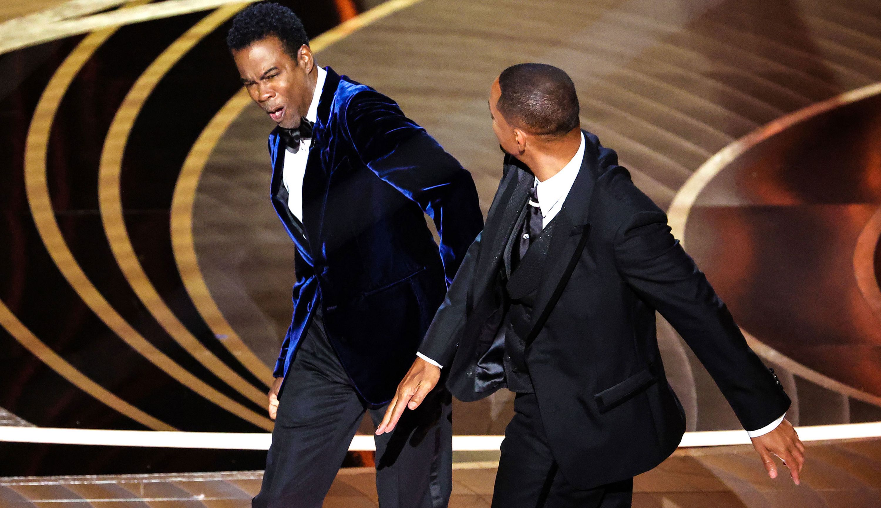 Actor Will Smith slaps comedian Chris Rock during the <a href="index.php?page=&url=http%3A%2F%2Fwww.cnn.com%2F2022%2F03%2F27%2Fentertainment%2Fgallery%2F2022-academy-awards-photos%2Findex.html" target="_blank">Academy Awards ceremony</a> on Sunday, March 27.