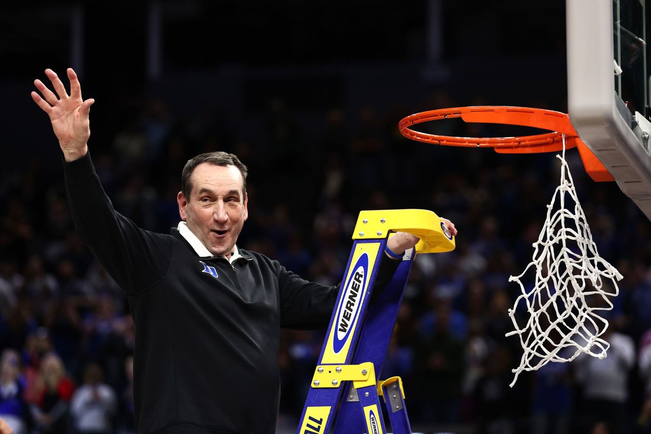 Duke head coach Mike Krzyzewski climbs a ladder to cut down the net Saturday, March 26, after his Blue Devils defeated Arkansas to advance to the Final Four. "Coach K," college basketball's all-time winningest coach, is retiring after this season. <a href="http://www.cnn.com/2021/06/02/us/gallery/mike-krzyzewski-career-coach-k/index.html" target="_blank">See his career in photos.</a>
