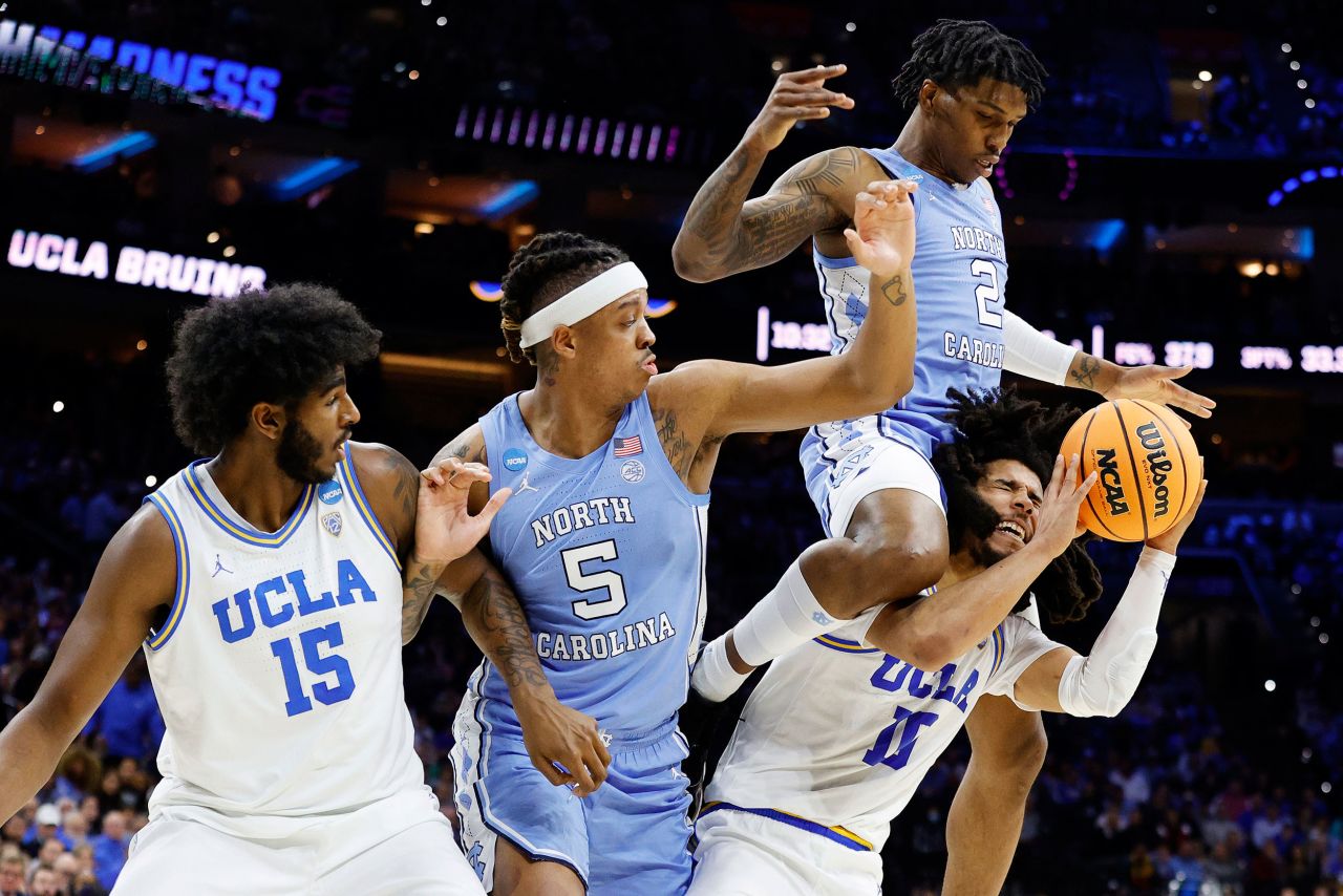 North Carolina's Caleb Love falls on top of UCLA's Tyger Campbell during an NCAA Tournament game on Friday, March 25. North Carolina won to advance to the Elite Eight.