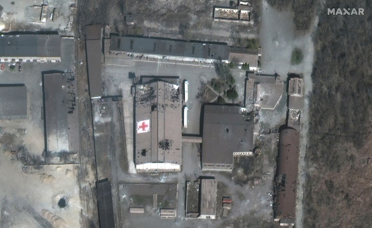 A satellite image shows a shelled warehouse that was being used by the Red Cross in Mariupol on March 29.   Zelensky says Russia waging war so Putin can stay in power &#8216;until the end of his life&#8217; 220401075039 03 ukraine gallery update 040122
