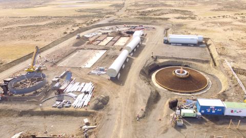 An aerial view of the construction site, including the foundations for its wind turbine.
