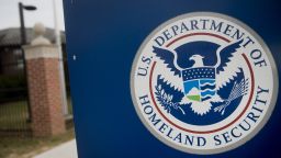 The U.S. Department of Homeland Security (DHS) seal stands at the agency's headquarters in Washington, D.C., U.S., on Thursday, Dec. 11, 2014. The U.S. House is set to pass a $1.1 trillion spending bill that includes a banking provision opposed by many Democrats as a giveaway to large institutions. Current funding for the government ends today, and the measure would finance most of the government through September 2015. The DHS, responsible for immigration policy, would be financed only through Feb. 27. Photographer: Andrew Harrer/Bloomberg via Getty Images