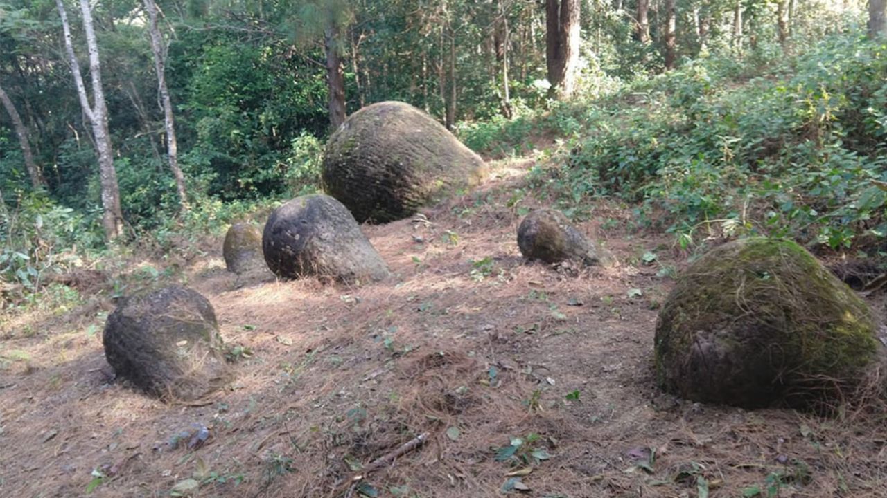 About 65 stone jars were discovered partially unearthed in northeastern India.