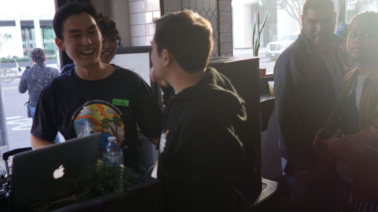 Axie Infinity Co-founder Jeff "The Jiho" Zirlin, center, greets  Albert "Aruchan" Takagi, left, at the Axie Infinity NFT LA party.