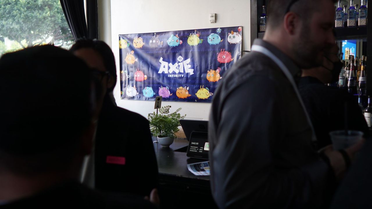 An Axie Infinity poster hangs at a meet-up in Los Angeles, California.