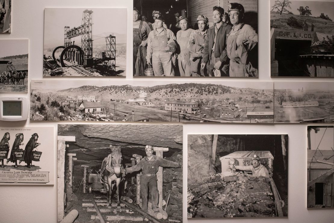 Historical photos of a mining operation are displayed at the Evraz offices in Pueblo.